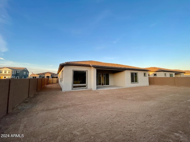 rear view of property with a patio area