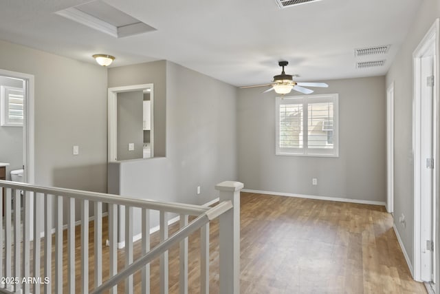 hall with hardwood / wood-style flooring