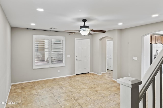 unfurnished room with ceiling fan