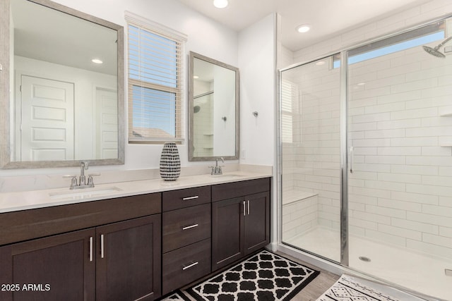 2250 E Palmdale Ln, Gilbert, AZ 85298 - bathroom with a shower stall, double vanity, and recessed lighting