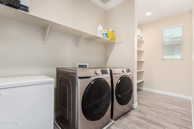 2250 E Palmdale Ln, Gilbert, AZ 85298 - washroom with separate washer and dryer, light wood finished floors, baseboards, and recessed lighting