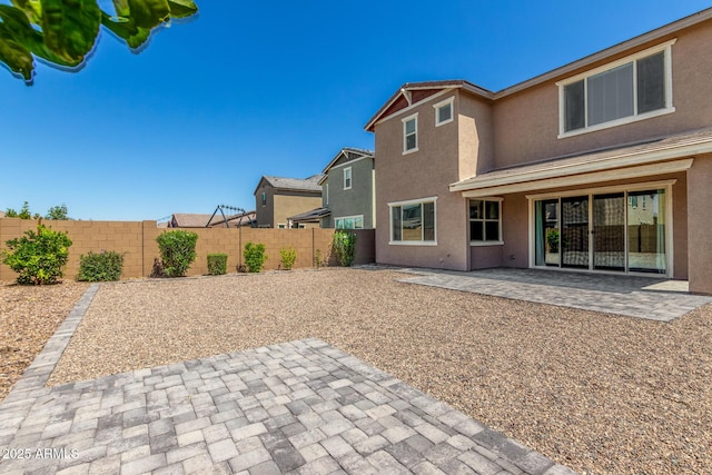 2250 E Palmdale Ln, Gilbert, AZ 85298 - rear view of house featuring stucco siding, a patio area, and a fenced backyard