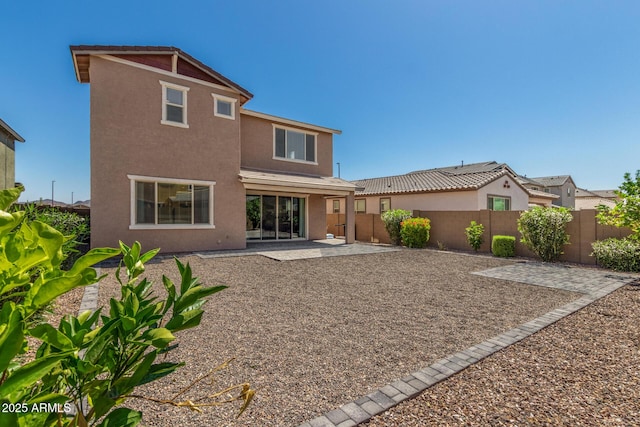 2250 E Palmdale Ln, Gilbert, AZ 85298 - back of house featuring stucco siding, a patio area, and a fenced backyard