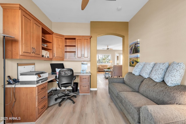 office area with light hardwood / wood-style floors and ceiling fan