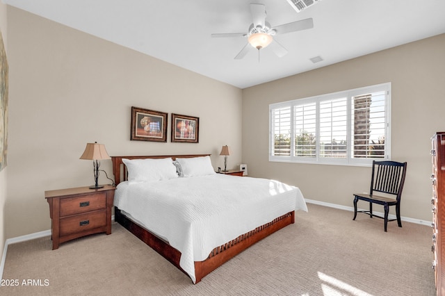 bedroom with ceiling fan and light carpet