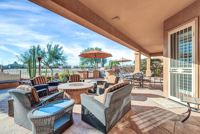 view of patio featuring an outdoor fire pit