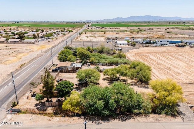 birds eye view of property with a mountain view and a rural view