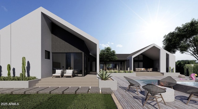 rear view of house featuring a patio area, a wooden deck, and an outdoor hangout area