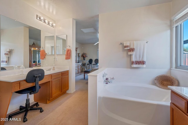 bathroom featuring a bath and vanity