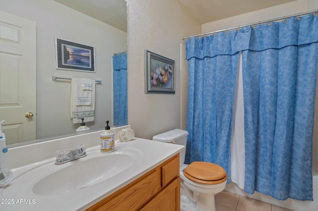 bathroom with tile patterned floors, vanity, and toilet