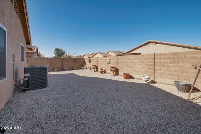 view of yard with central air condition unit