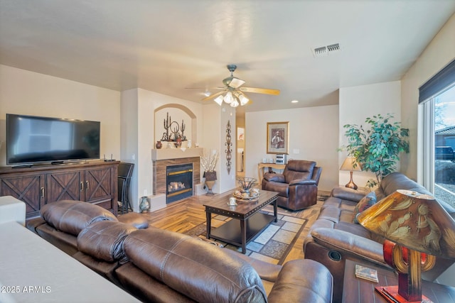 living room featuring ceiling fan and light parquet flooring