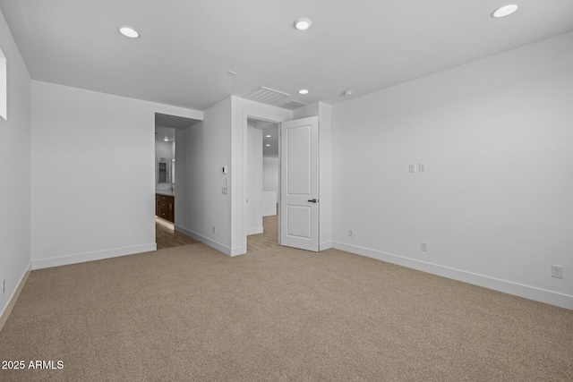 unfurnished bedroom featuring baseboards, recessed lighting, carpet, and ensuite bath