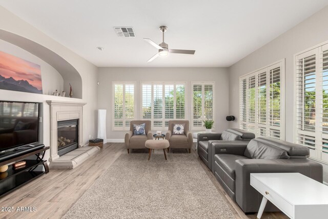16201 S 29th Ave, Phoenix, AZ 85045 - living area featuring visible vents, a ceiling fan, light wood-style flooring, and a healthy amount of sunlight