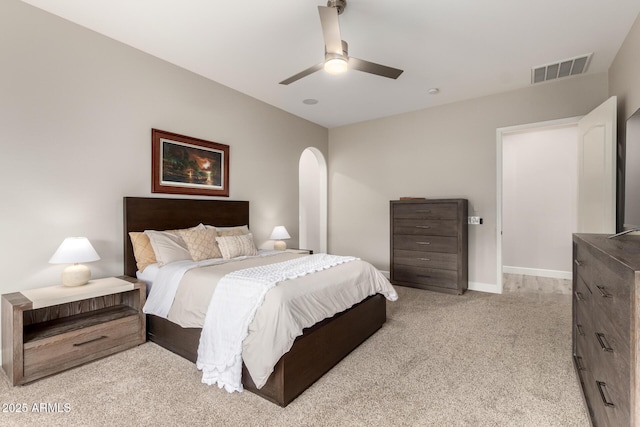 16201 S 29th Ave, Phoenix, AZ 85045 - bedroom featuring a ceiling fan, light colored carpet, visible vents, arched walkways, and baseboards
