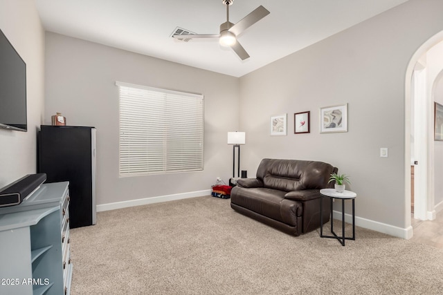 16201 S 29th Ave, Phoenix, AZ 85045 - sitting room with carpet floors, arched walkways, ceiling fan, and baseboards