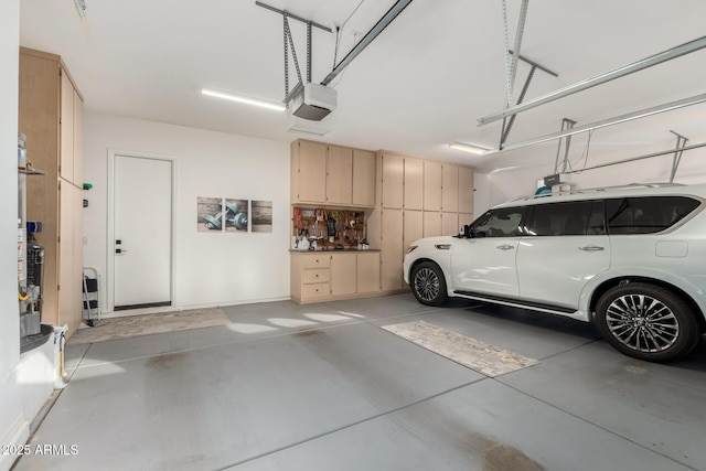16201 S 29th Ave, Phoenix, AZ 85045 - garage with baseboards and a garage door opener