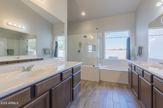 bathroom with vanity, hardwood / wood-style flooring, a healthy amount of sunlight, and independent shower and bath