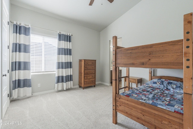 bedroom with light colored carpet, lofted ceiling, and ceiling fan