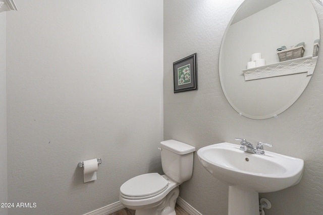 bathroom with toilet and sink