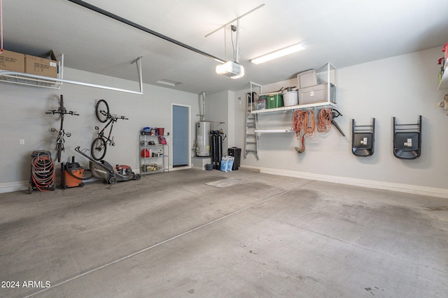 garage featuring a garage door opener and gas water heater