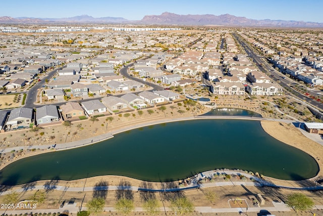 bird's eye view with a water and mountain view