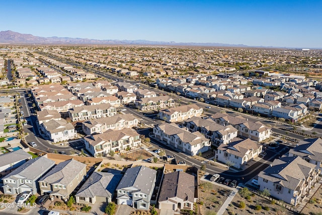 birds eye view of property with a mountain view