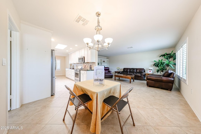 dining area featuring a chandelier, light tile patterned floors, recessed lighting, and baseboards