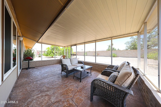 sunroom / solarium with an outdoor hangout area and plenty of natural light
