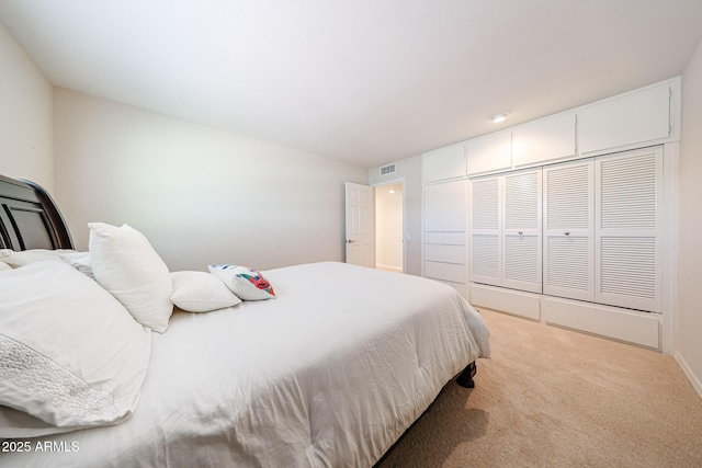bedroom featuring carpet flooring, a closet, and baseboards