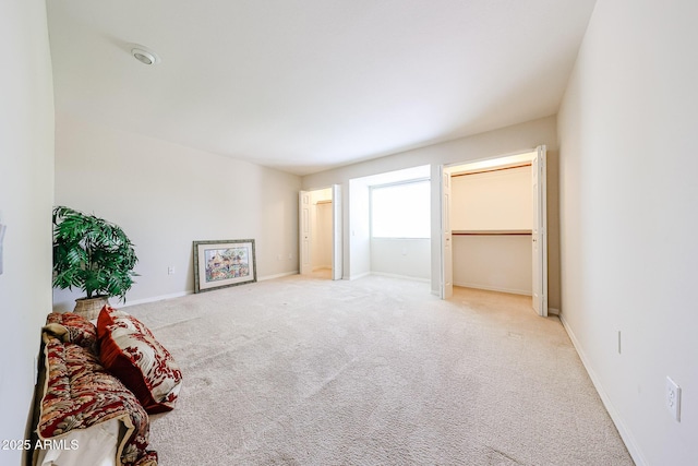 carpeted bedroom featuring baseboards