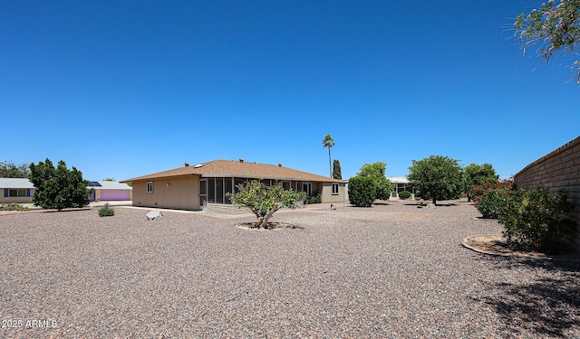 back of property featuring a sunroom