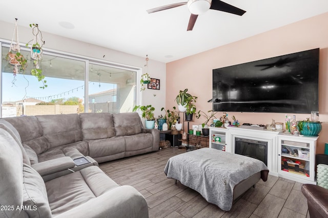 living room featuring ceiling fan