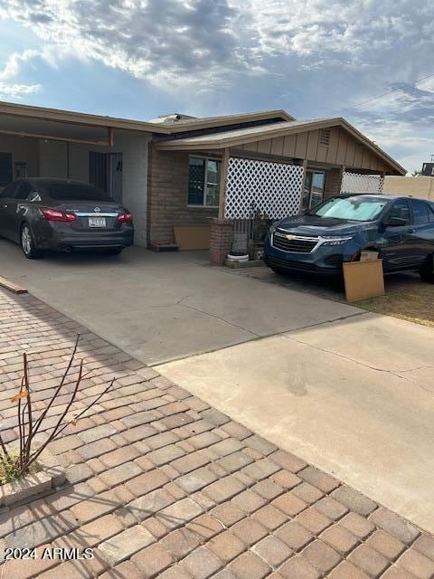 view of side of home featuring a carport