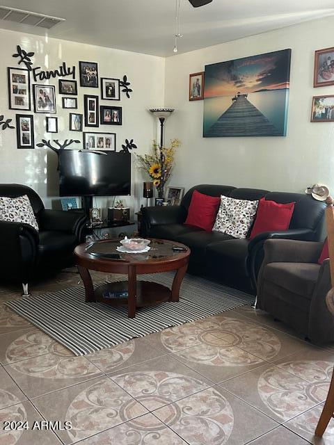 living room with tile patterned floors