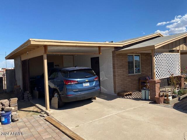 view of car parking featuring a carport