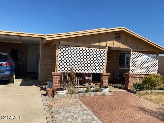 view of front of home featuring a carport