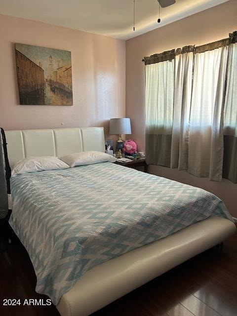 bedroom featuring hardwood / wood-style floors and ceiling fan