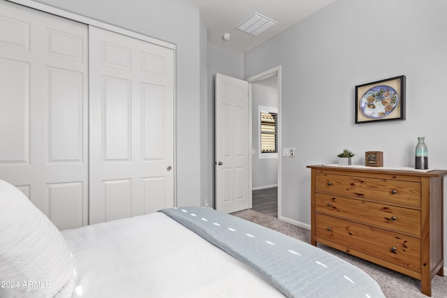 bedroom with a closet and carpet