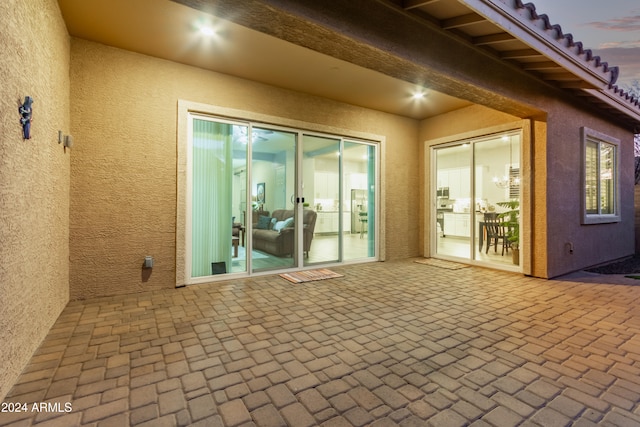 view of patio terrace at dusk