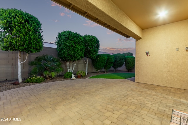 view of patio terrace at dusk