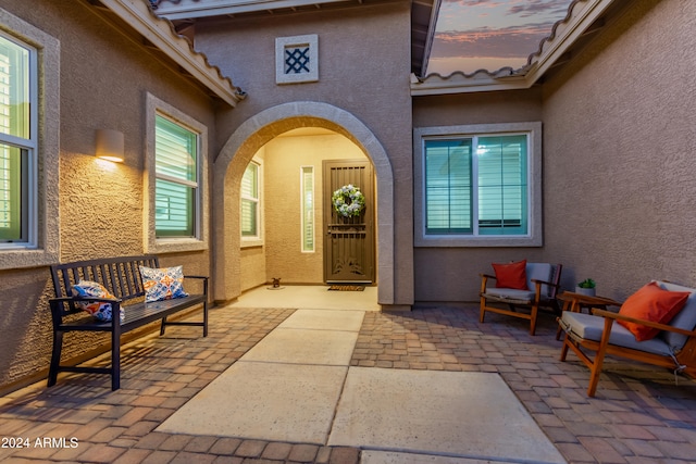 property entrance with outdoor lounge area and a patio area