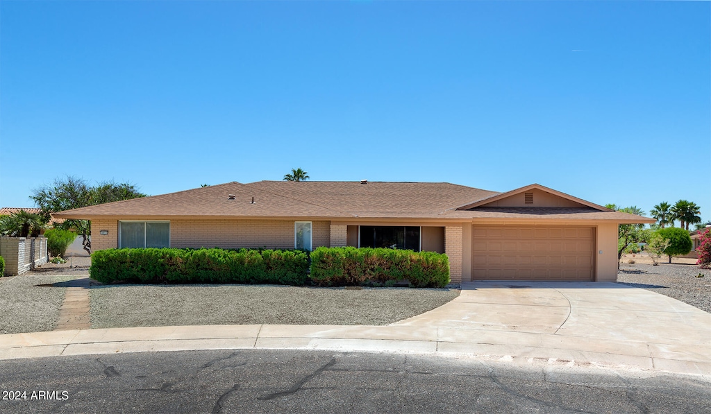 ranch-style house featuring a garage