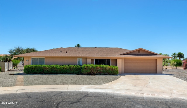 ranch-style house featuring a garage