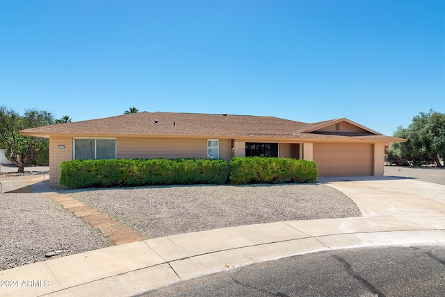 ranch-style home with a garage