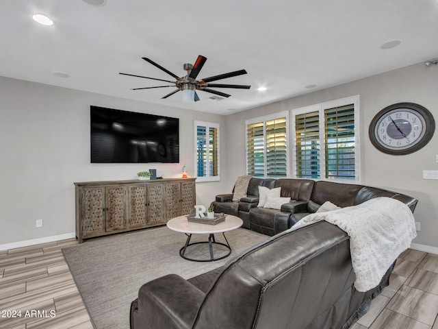 living room with hardwood / wood-style flooring and ceiling fan