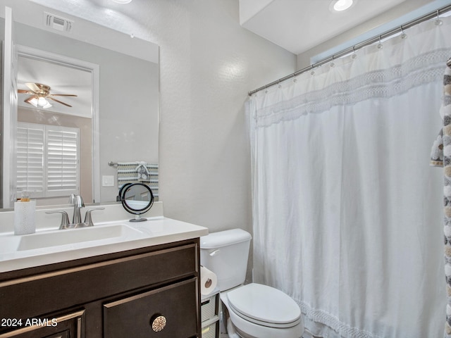 bathroom with ceiling fan, vanity, and toilet