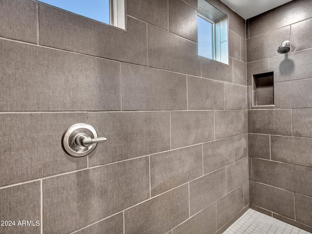 bathroom with tiled shower