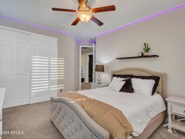 bedroom with ceiling fan and light carpet