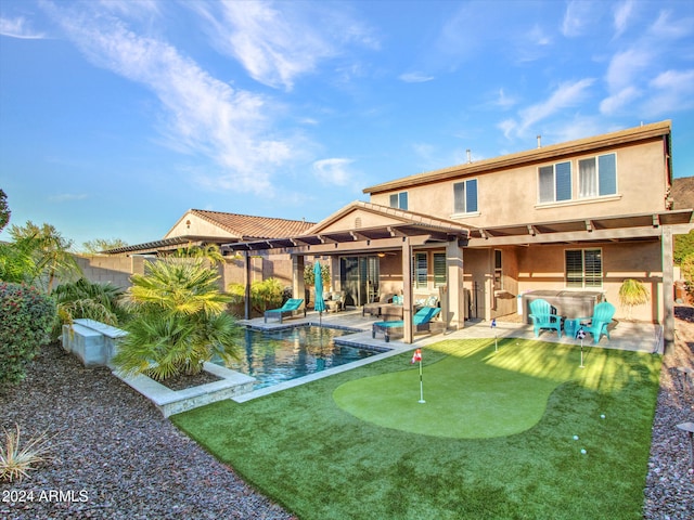 rear view of property with a patio area and outdoor lounge area